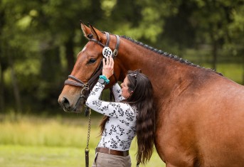 Tyler with her homebred 2022 Premium Holsteiner mare trainer with horse